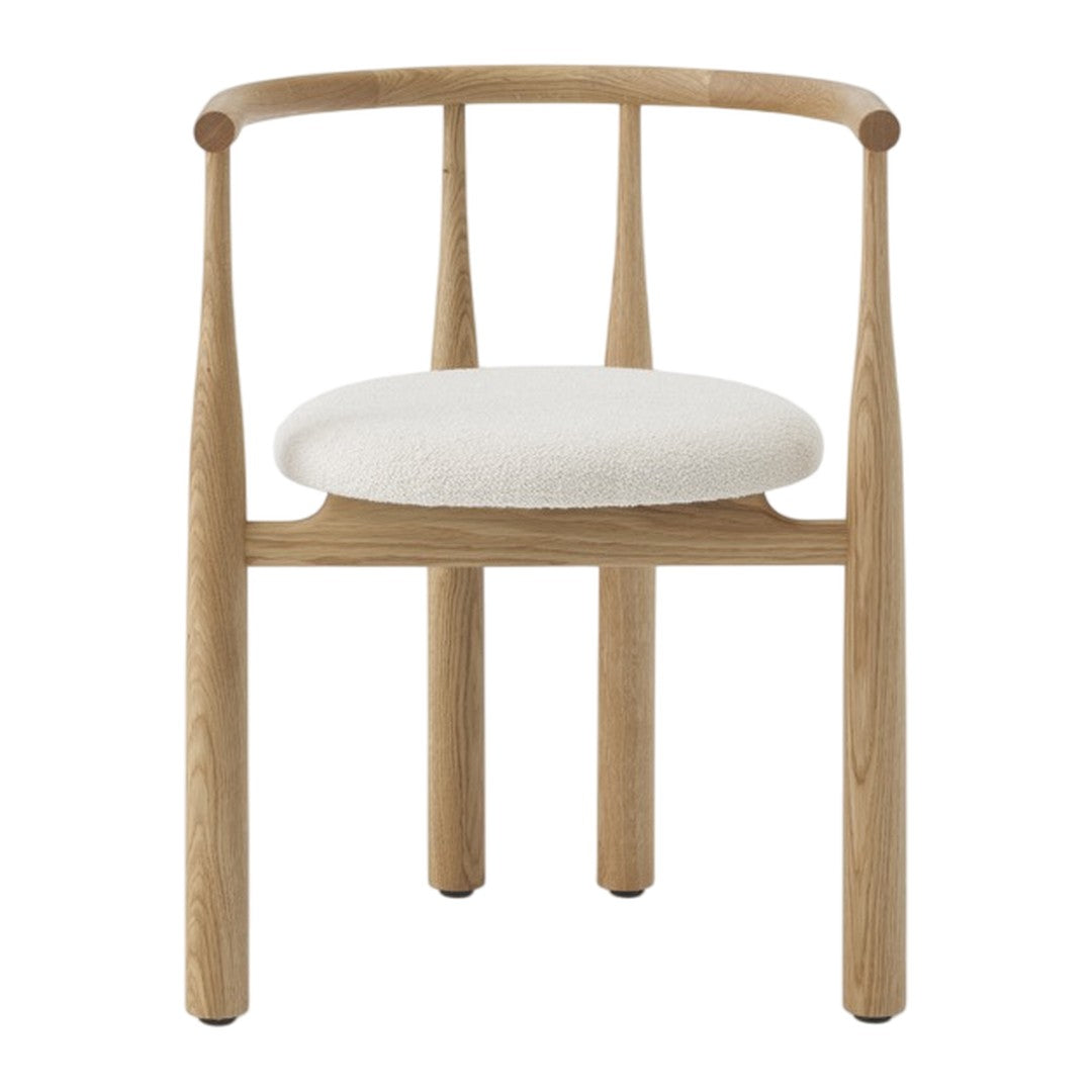 Wooden chair with a white cushion on a white background