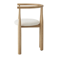 Wooden chair with a white cushion on a white background