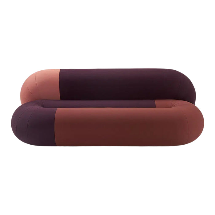 Modern two-tone sofa featuring deep plum and warm terracotta colors with smooth, rounded edges and a minimalist design.