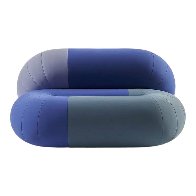 Stylish rounded sofa in shades of blue and teal with a modern two-tone pattern. Perfect for contemporary decor.