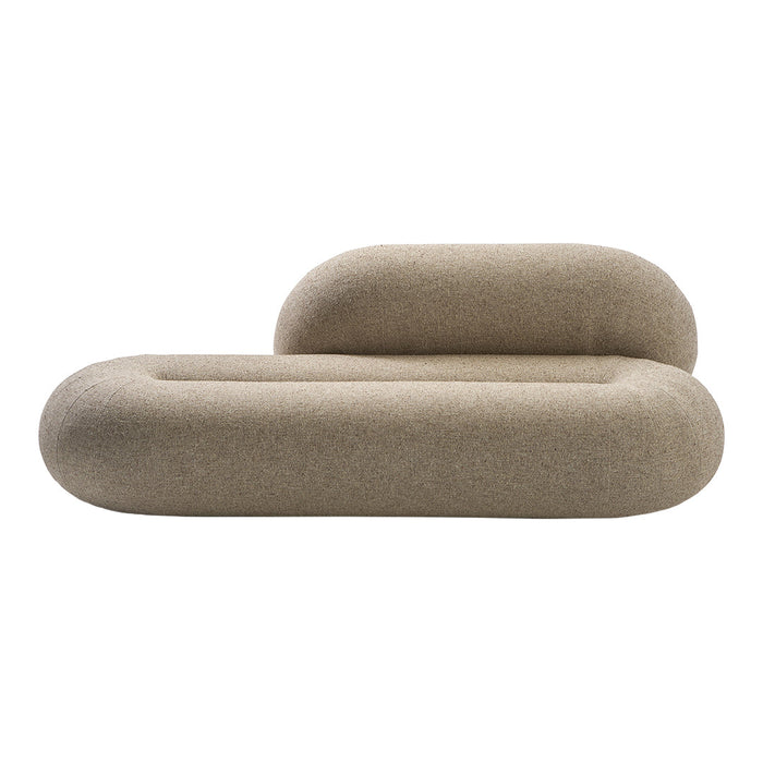 Beige sculptural sofa with rounded edges, featuring a soft, textured fabric. Modern minimalistic design.