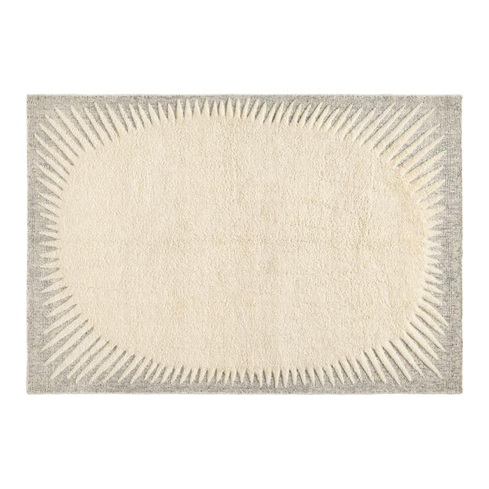Cream and gray oval rug with a textured sunburst pattern around the edges. Ideal for modern and cozy interiors.