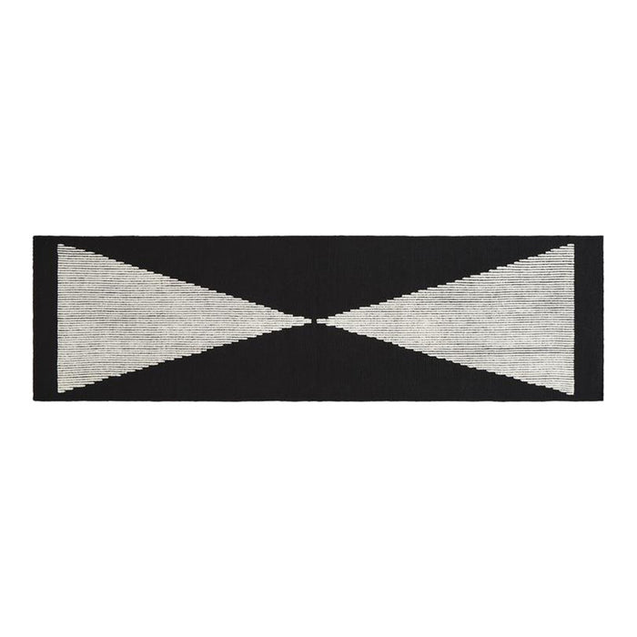 Black and white geometric pattern rug with triangular shapes and horizontal lines, perfect for modern decor.