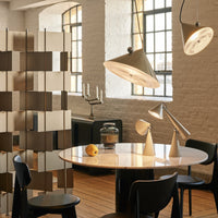 Contemporary living space featuring a mix of soft gray, warm beige, and sleek black with geometric patterns.