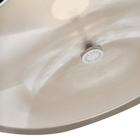 Glossy beige lamp shade with subtle reflections and a sleek metallic knob, providing a modern aesthetic.