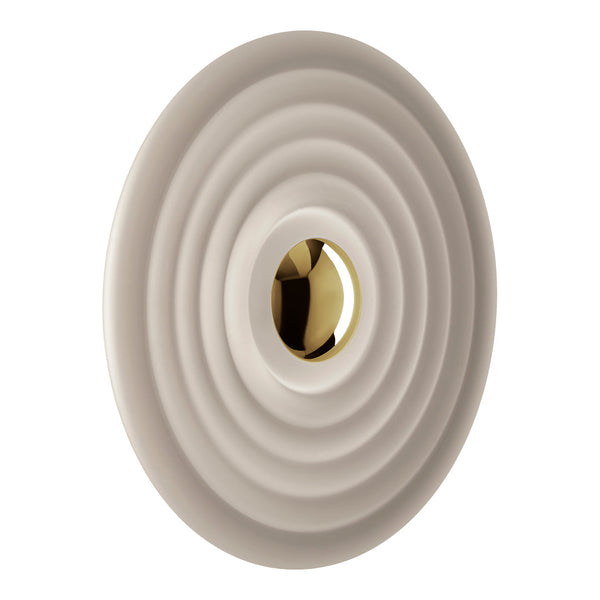 Cream circular wall fixture with concentric ripple patterns and a polished gold center.
