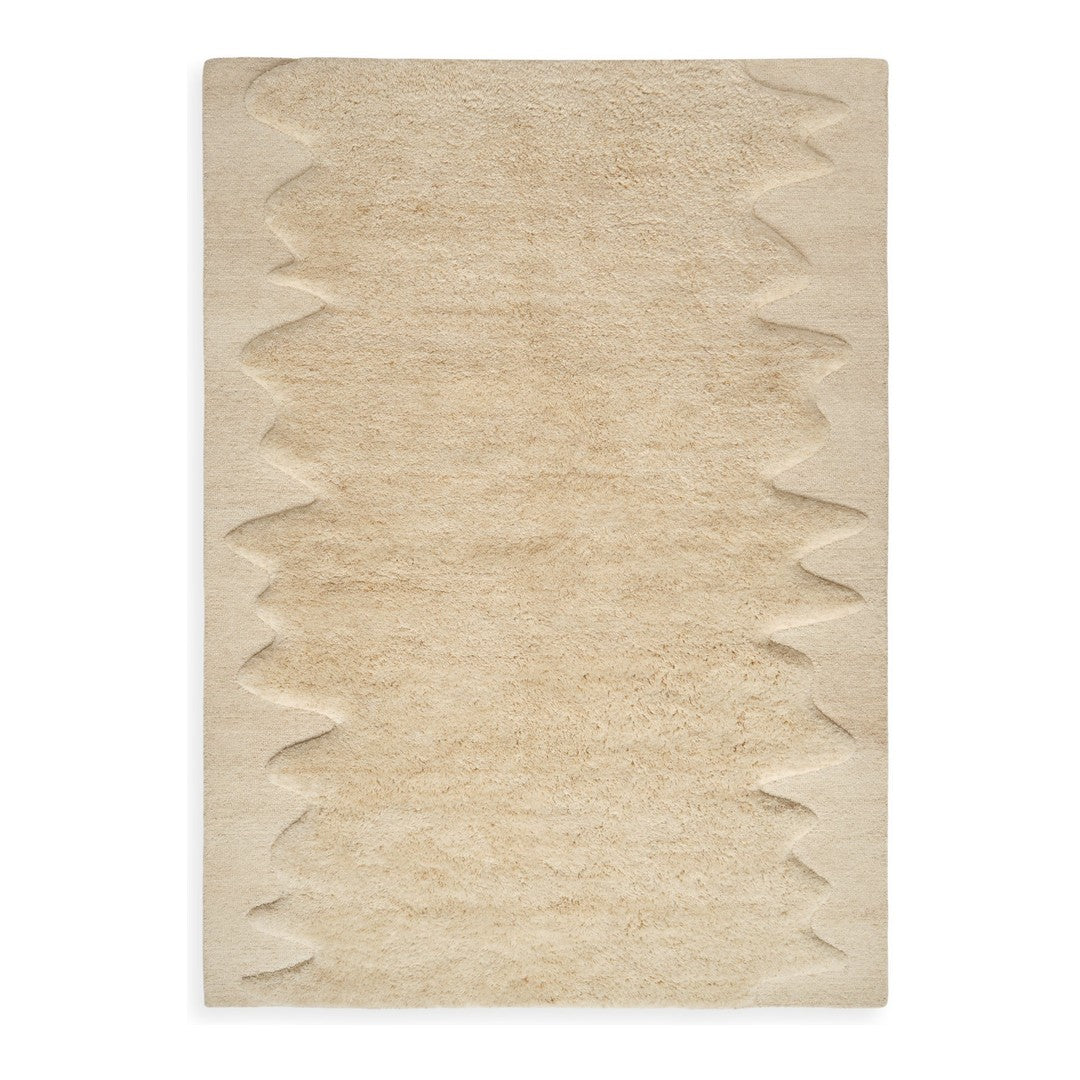 Beige textured rug with a zigzag pattern along the edges, adding depth and style to any space.