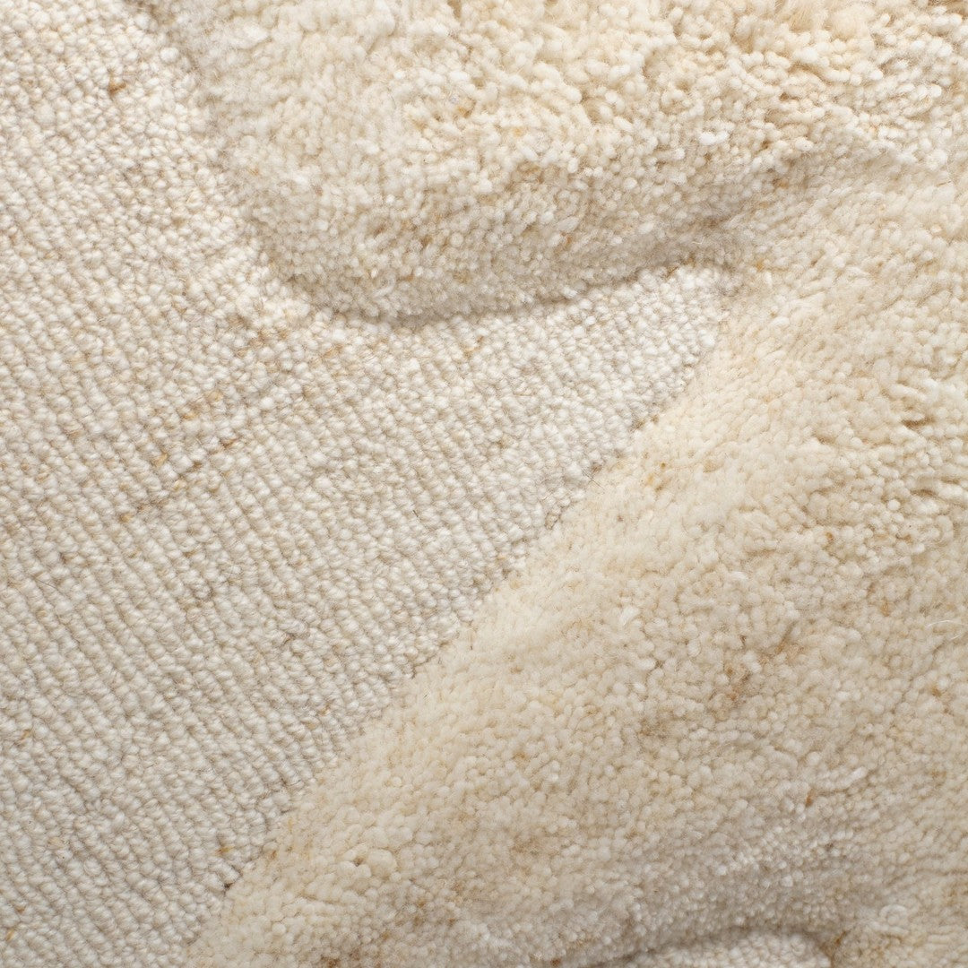 Beige textured fabric with soft, subtle patterns in varying shades of cream. Ideal for a cozy, neutral decor.