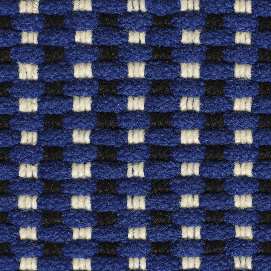 Blue and black woven pattern with white accents, creating a striking contrast and texture.