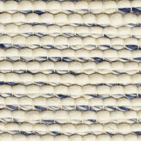 Beige and navy blue patterned textile with hexagonal weaves, ideal for home decor designs.