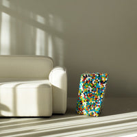 Colorful patterned accent piece featuring vibrant dots in blue, red, yellow, and white against a neutral background.