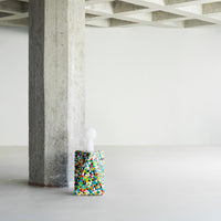 Colorful lamp base featuring a vibrant confetti pattern with shades of blue, yellow, red, and green.