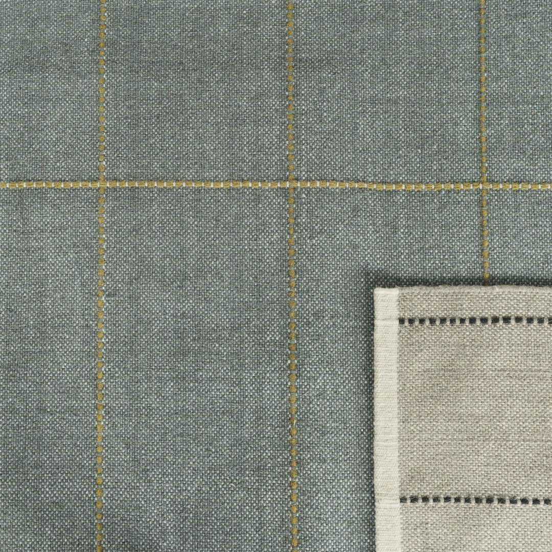Gray fabric featuring a grid pattern with yellow stitching and a natural linen edge detail. Perfect for home decor.