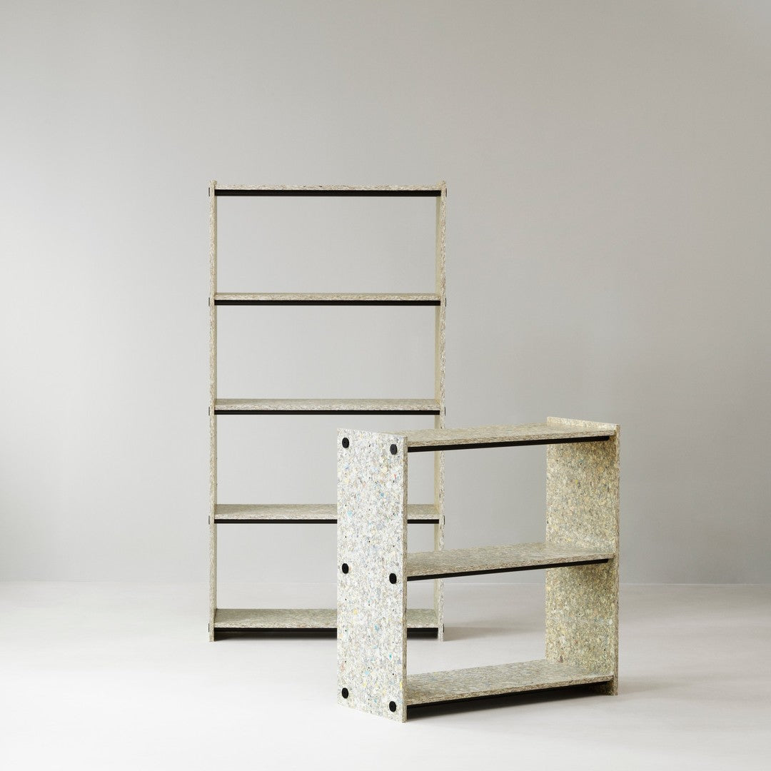Two shelving units featuring a speckled white and gray pattern with sleek black accents against a neutral background.