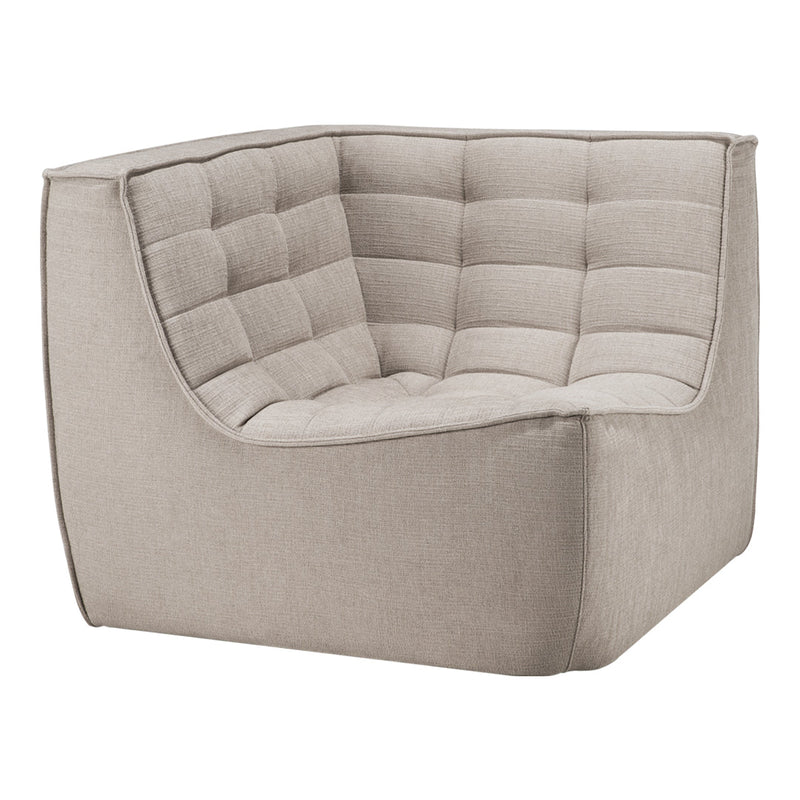 Beige corner chair with tufted fabric, featuring a minimalist design and soft, textured upholstery. Perfect for modern decor.