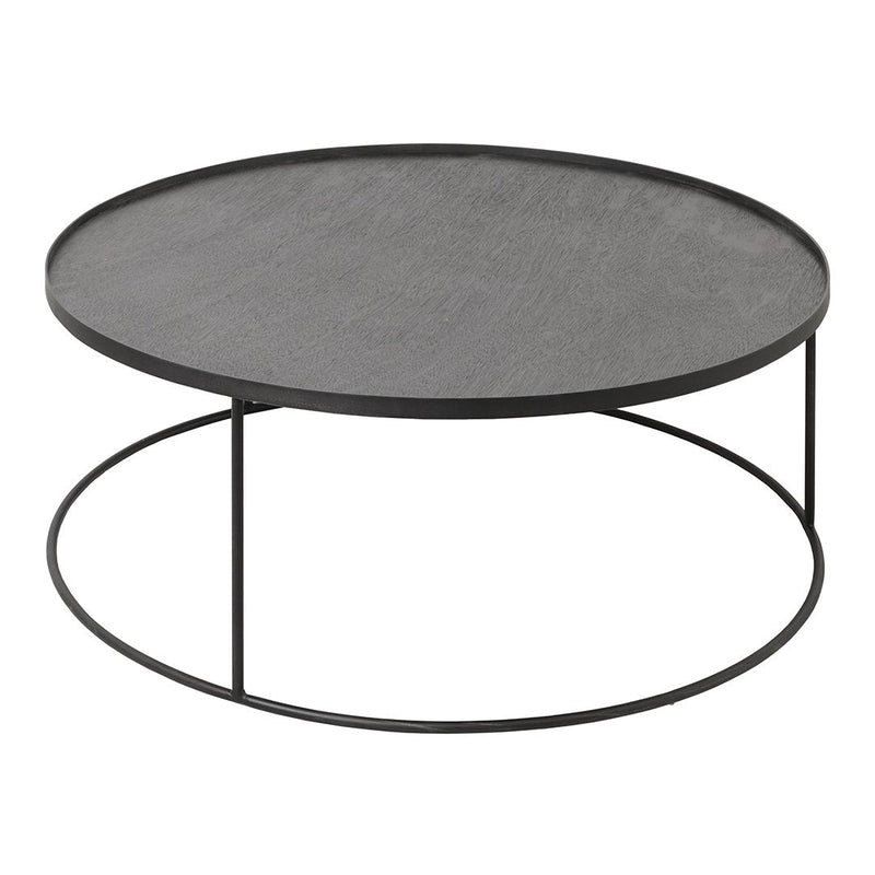 Round black coffee table with a sleek wood top and minimalist metal base. Modern design with a smooth surface.