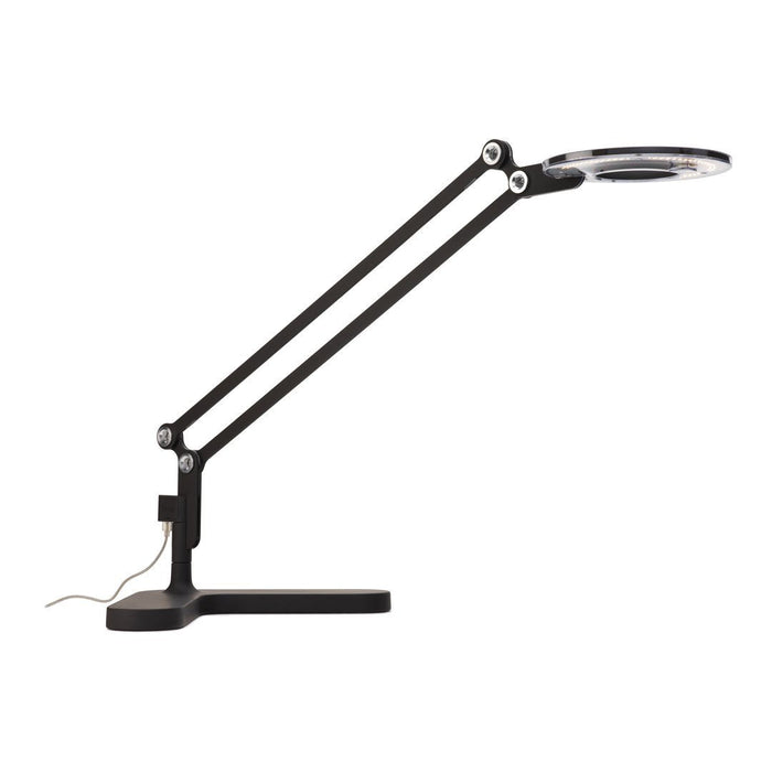 Black adjustable lamp with a circular clear lens and sleek metallic accents. Modern design with a minimalist aesthetic.