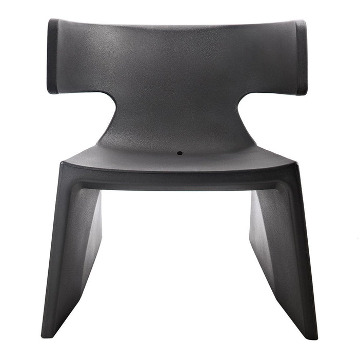 "Minimalist black chair with smooth, sleek surface and modern, angular design."