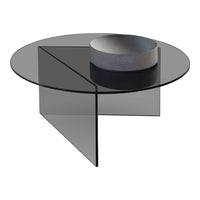 Black glass round coffee table with a geometric design and smooth surface, complemented by a minimalist gray bowl.