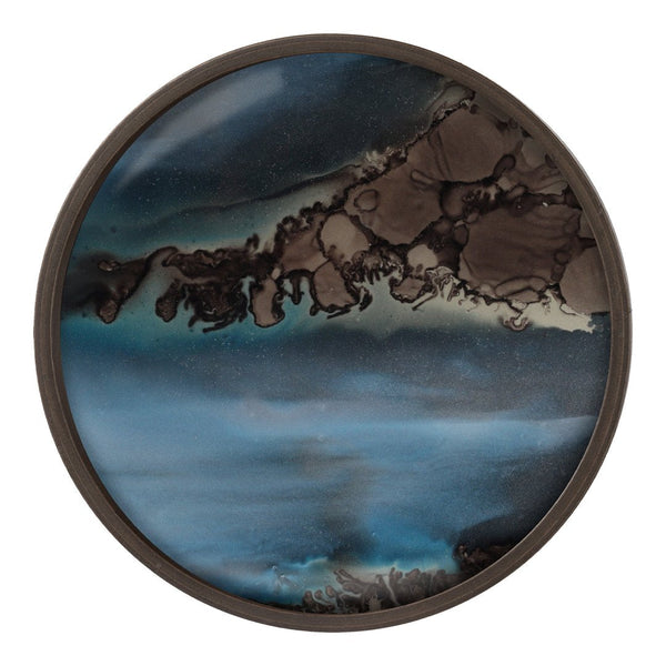 Round decorative plate featuring abstract blue and black patterns with a smooth, glossy finish. Ideal for stylish decor.