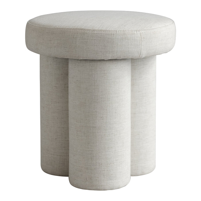 Light beige round stool with a textured fabric and three cylindrical legs for a modern, minimalist look.