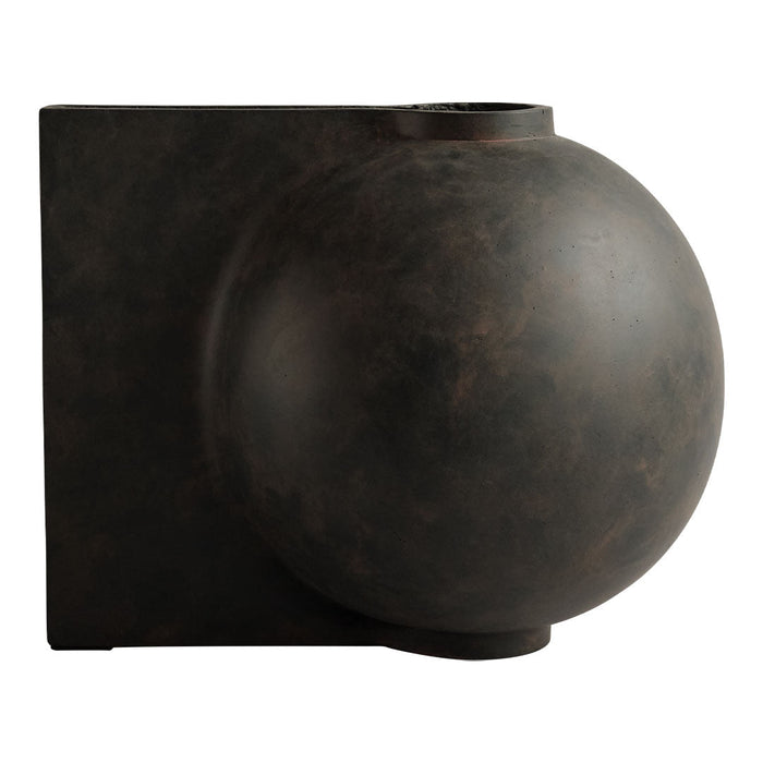 Bronze wall sconce featuring a smooth, round orb and a square base, combining modern and minimalist design elements.