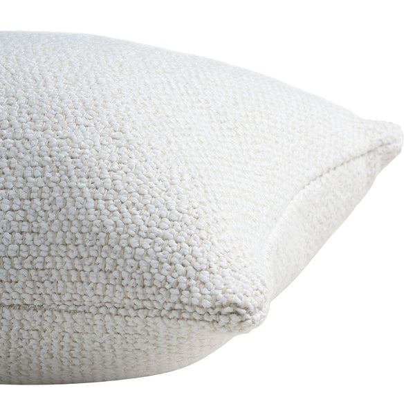 Textured cream pillow in soft boucle fabric, adding a cozy touch to any decor. Perfect for modern and neutral aesthetics.