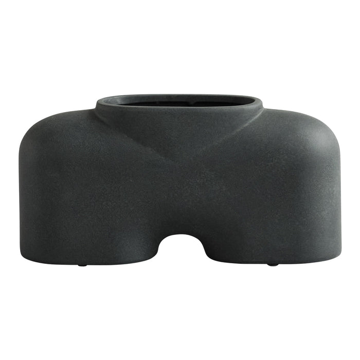 Sleek black ceramic planter with a matte finish and minimalist design, perfect for modern decor.