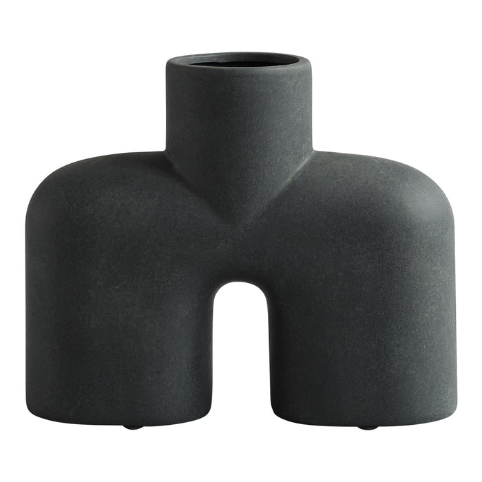 Black geometric vase with a matte finish and unique, abstract shape. Ideal for modern decor styles.