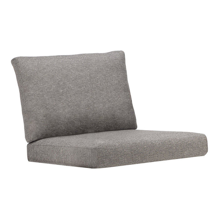 Gray upholstered lounge chair with a smooth texture and minimalist design. Perfect for modern decor styles.
