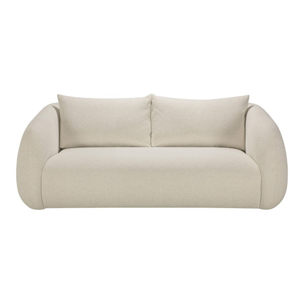 Beige sofa with rounded arms and plush cushions, featuring a smooth, textured fabric finish. Perfect for modern decor.