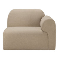 Minimalist beige accent chair with soft textures and smooth curves, perfect for modern decor.