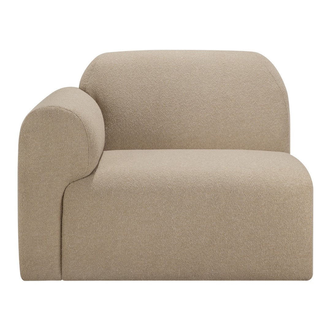 Tan curved accent chair with soft texture and minimalist design, perfect for modern interiors.