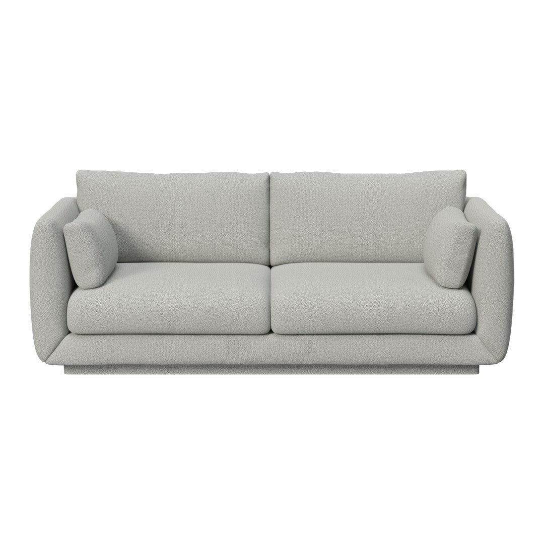 Light gray upholstered sofa with smooth texture and minimalistic design, featuring rounded cushions and clean lines.