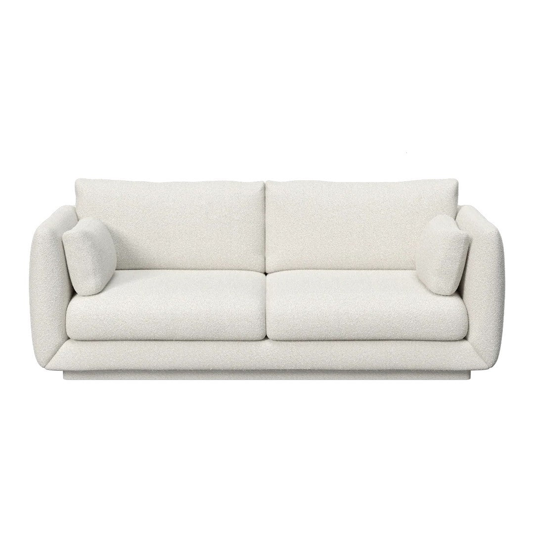 Cozy white upholstered sofa with two matching cushions and a sleek, modern design. Perfect for any living space.