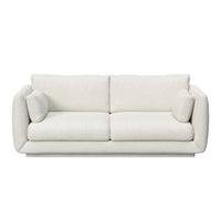 Cozy white upholstered sofa with two matching cushions and a sleek, modern design. Perfect for any living space.