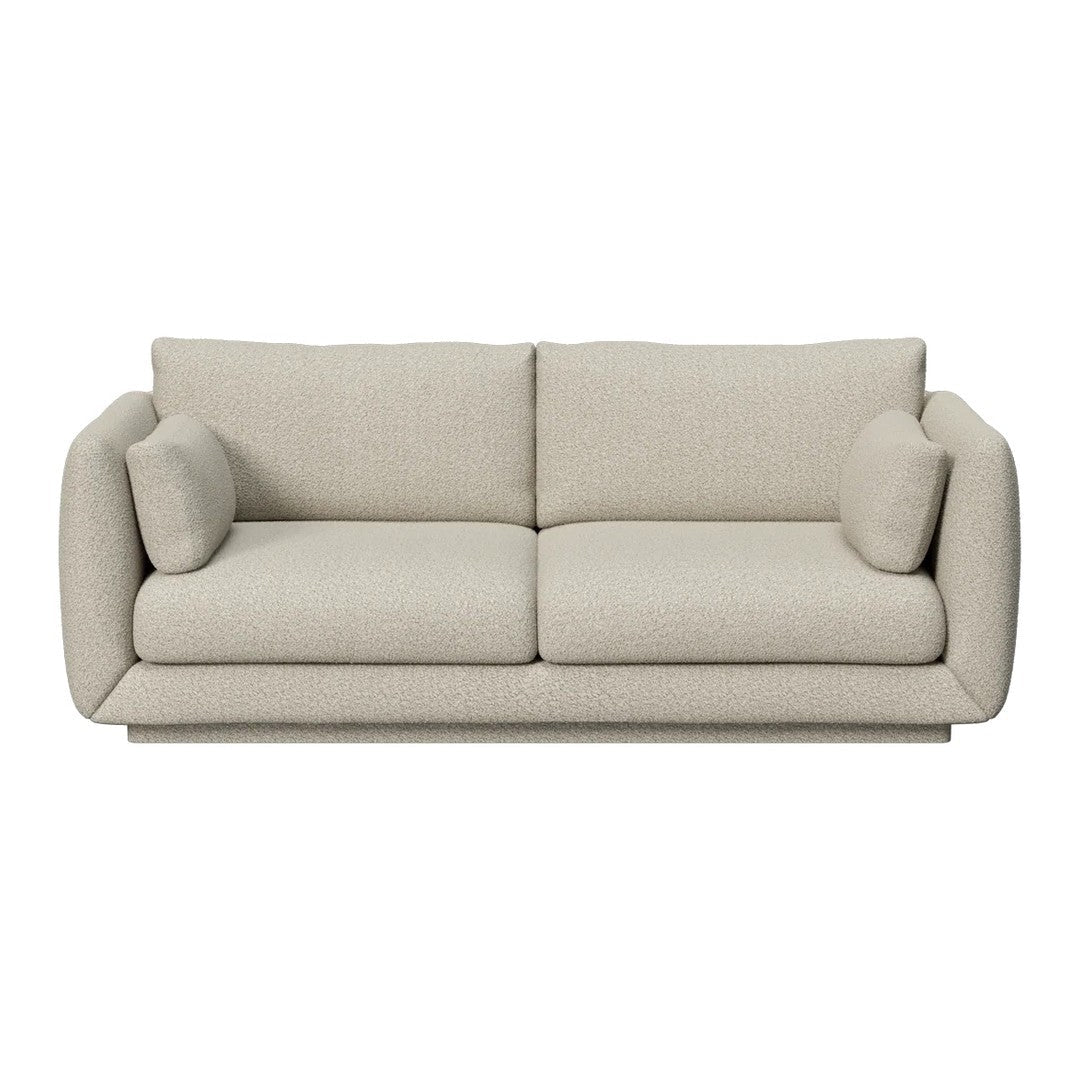 Beige sofa with smooth texture and minimalist design, featuring round armrests and plush cushions.