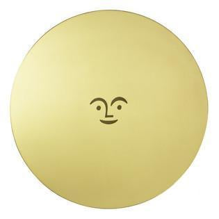 Gold round plate featuring a simple smiling face design in the center, minimalistic and playful.