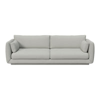 Light gray upholstered sofa with smooth fabric and modern minimalist design. Ideal for contemporary living spaces.