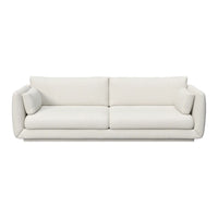 Modern, plush white sofa with smooth, minimalist design and rounded arms, ideal for contemporary interiors.