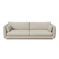 Light beige sofa with a smooth texture and minimalistic design. Ideal for modern, neutral decor.