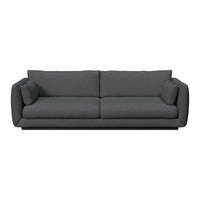 Plush gray sofa with a simple, solid fabric design and clean lines, perfect for modern living spaces.