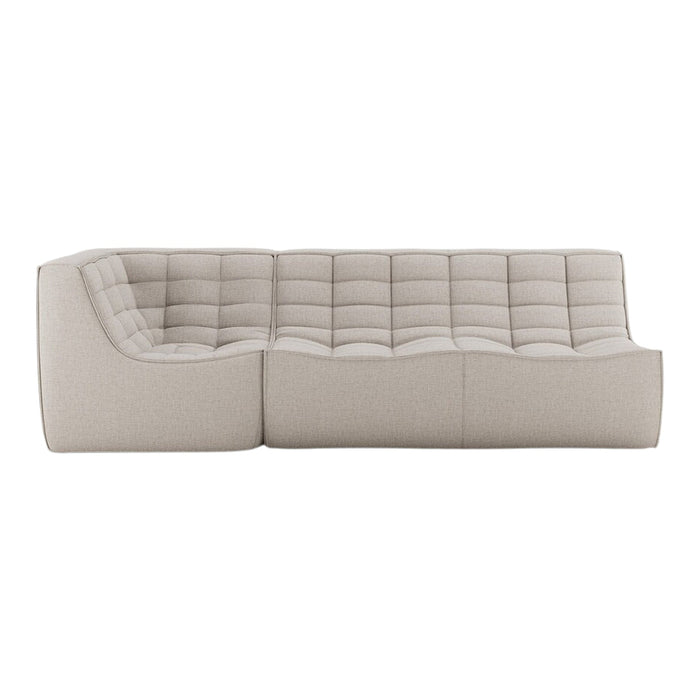 Beige tufted sofa in a contemporary design, featuring a smooth, textured fabric with a minimalist aesthetic.