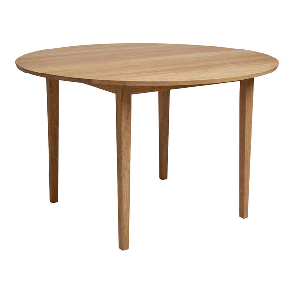 Light oak round table with a smooth finish and simple straight legs, showcasing natural wood grain patterns.