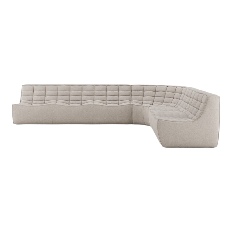 Beige sectional sofa with tufted upholstery, featuring a modern, textured pattern and sleek, curved design.