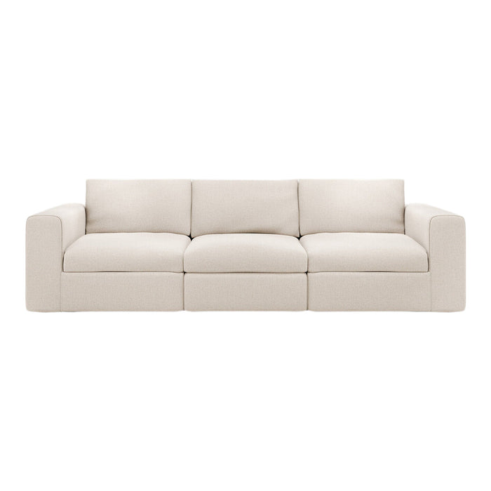 Beige modular sofa with a soft, textured fabric and clean lines, perfect for modern living spaces.