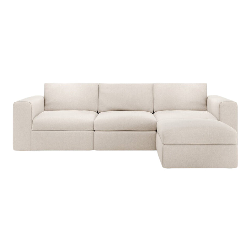Light beige sectional sofa with a smooth, textured fabric and a minimalist modern design. Perfect for any living space.