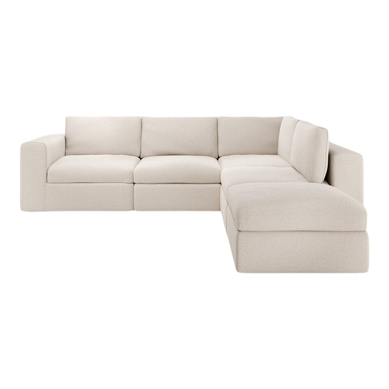 Light beige modular sectional sofa with a sleek, minimalist design, showcasing a textured, soft fabric finish.
