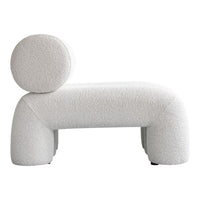 Textured light beige lounge chair with a rounded backrest and soft, plush fabric. Modern, minimalist design.