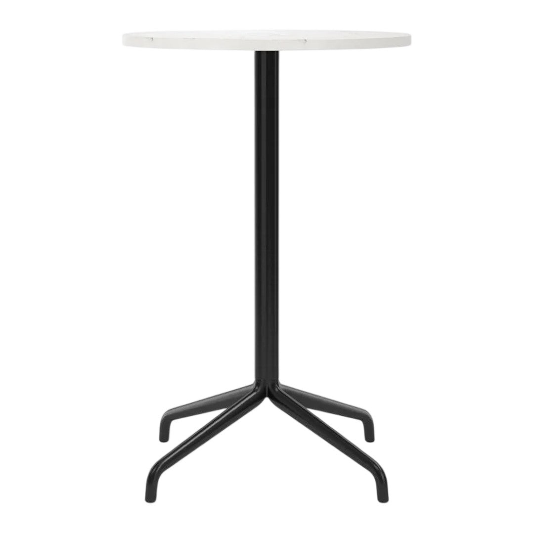 Round white tabletop with sleek black metal legs, featuring a modern minimalist design.